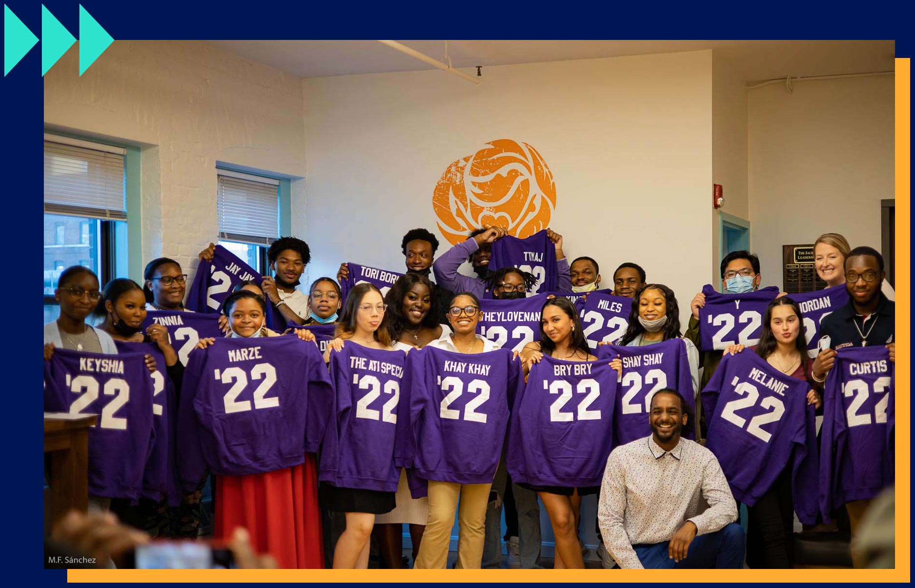image of group of Camp Harbor View 2022 graduates holding purple name t-shirts